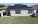 View of the home's solar panels from the yard, offering an efficient energy source at 901 Golden Shiner Ave, Ruskin, FL 33570