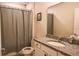 This bathroom features a mirror, neutral walls, and a granite countertop at 901 Golden Shiner Ave, Ruskin, FL 33570