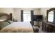 Spacious bedroom with elegant furniture, plush carpet, and plenty of natural light at 901 Golden Shiner Ave, Ruskin, FL 33570
