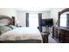 Spacious bedroom with elegant furniture, plush carpet, and plenty of natural light at 901 Golden Shiner Ave, Ruskin, FL 33570