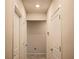 This hallway features neutral walls and tiled floors, with two doors visible at 901 Golden Shiner Ave, Ruskin, FL 33570