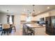Modern kitchen with a large island, stainless steel appliances, and ample cabinet space at 901 Golden Shiner Ave, Ruskin, FL 33570