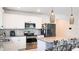 Modern kitchen with stainless steel appliances and granite countertops at 901 Golden Shiner Ave, Ruskin, FL 33570