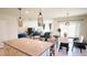 Bright, open living space featuring a granite island, dining area, and comfortable seating at 901 Golden Shiner Ave, Ruskin, FL 33570