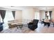 Inviting living room featuring a large comfortable sectional, area rug, and a dining area with stylish pendant lighting at 901 Golden Shiner Ave, Ruskin, FL 33570