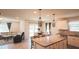 Open living space showcasing an island kitchen, dining area, and comfortable living room at 901 Golden Shiner Ave, Ruskin, FL 33570