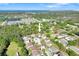 Aerial view of a home nestled among lush trees and neighborhood at 9102 Kentucky Day Ct, Gibsonton, FL 33534