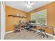 Bright bedroom or office space with hardwood floors, featuring two windows and ample workspace at 9102 Kentucky Day Ct, Gibsonton, FL 33534