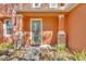 Inviting front entry with decorative stone pillars and a stylish green-framed glass door at 9102 Kentucky Day Ct, Gibsonton, FL 33534