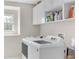 Functional laundry room with a front loading washer and dryer at 9102 Kentucky Day Ct, Gibsonton, FL 33534
