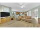 Comfortable living room with hardwood floors, offering seamless connectivity to the kitchen and staircase at 9102 Kentucky Day Ct, Gibsonton, FL 33534