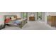 Spacious main bedroom with a large bed, carpeted floors, and natural light at 9102 Kentucky Day Ct, Gibsonton, FL 33534