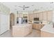 Well-lit kitchen with stainless steel appliances and a large central island at 10228 Estuary Dr, Tampa, FL 33647