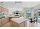 This spacious kitchen has an island and a view of the pool at 10228 Estuary Dr, Tampa, FL 33647