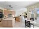 Open kitchen featuring island, breakfast nook, and view of the living room at 10228 Estuary Dr, Tampa, FL 33647
