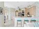 Well-lit kitchen with stainless steel appliances, breakfast bar and modern cabinets at 10228 Estuary Dr, Tampa, FL 33647