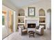 Inviting living room featuring a fireplace and access to a screened patio at 10228 Estuary Dr, Tampa, FL 33647