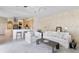 Open concept living room featuring a connecting kitchen and breakfast bar seating at 10228 Estuary Dr, Tampa, FL 33647
