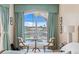 Cozy sitting area in this bedroom with a great view of the pool at 10228 Estuary Dr, Tampa, FL 33647