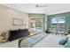This main bedroom has patio access and a great view of the pool at 10228 Estuary Dr, Tampa, FL 33647