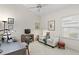 Home office features a large work desk and a seating area, creating a functional and inviting workspace at 10228 Estuary Dr, Tampa, FL 33647