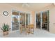 Outdoor patio showcasing a table and chairs with sliding glass doors leading indoors at 10228 Estuary Dr, Tampa, FL 33647