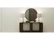 Stylish entryway with console table, decorative lamps, and circular mirror at 11959 Brae Way, Dade City, FL 33525
