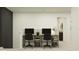 Office space features two desks with rolling chairs and a view of the hallway at 11959 Brae Way, Dade City, FL 33525