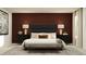 Stylish bedroom with a padded headboard, modern lamps, and comfortable bench at 11959 Brae Way, Dade City, FL 33525