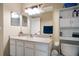 Bright bathroom with white cabinets, large mirror, and plenty of storage space for an organized and refreshing feel at 12346 Country White Cir, Tampa, FL 33635