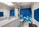 Bright bathroom featuring a vanity, toilet, tub, and shower at 12346 Country White Cir, Tampa, FL 33635