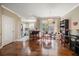 Open-concept dining area with hardwood floors, seamlessly connected to the kitchen and living spaces at 12346 Country White Cir, Tampa, FL 33635