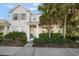 Charming two-story townhouse with lush landscaping, a quaint front porch, and neutral exteriors at 12346 Country White Cir, Tampa, FL 33635