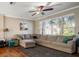 Living room featuring a large sectional couch, area rug, and natural light at 12346 Country White Cir, Tampa, FL 33635