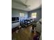 Bedroom with hardwood floors, two windows and a ceiling fan at 1448 Lemon St, Clearwater, FL 33756