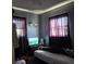 Comfortable bedroom with natural light, neutral-colored walls, and modern blinds at 1448 Lemon St, Clearwater, FL 33756