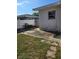 Driveway leading to backyard with a white fence at 1448 Lemon St, Clearwater, FL 33756