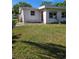 Exterior showing the side of the home with a grassy front yard at 1448 Lemon St, Clearwater, FL 33756
