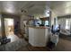 Functional kitchen area with laminate flooring, modern appliances, and adjacent breakfast bar at 1448 Lemon St, Clearwater, FL 33756