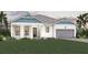 Charming single-story home featuring a two-car garage, manicured lawn, and a welcoming front porch at 18057 Foxtail Loop, Venice, FL 34293