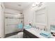 Bright bathroom featuring a glass-enclosed shower, modern vanity with a sink at 18187 Paradise Point Dr, Tampa, FL 33647