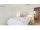Cozy bedroom with white bedding, closet, and ensuite bathroom at 18187 Paradise Point Dr, Tampa, FL 33647
