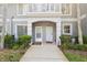 Inviting condo entrance with decorative archway and well-maintained landscaping at 18187 Paradise Point Dr, Tampa, FL 33647