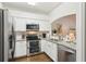 Updated kitchen with granite countertops, stainless steel appliances and white cabinets at 18187 Paradise Point Dr, Tampa, FL 33647