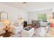 Open-concept living area with a dining table and chairs, modern decor, and natural light at 18187 Paradise Point Dr, Tampa, FL 33647