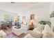 Open living space combining a dining and living area with bright, natural light at 18187 Paradise Point Dr, Tampa, FL 33647
