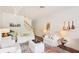 Bright living room with white sofas, decorative rug, and stylish artwork creates a cozy atmosphere at 18187 Paradise Point Dr, Tampa, FL 33647