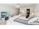 Comfortable main bedroom with modern decor, TV, and ensuite bathroom at 18187 Paradise Point Dr, Tampa, FL 33647