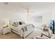 Airy main bedroom with ceiling fan, a queen bed, and neutral carpeting at 18187 Paradise Point Dr, Tampa, FL 33647