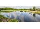 Picturesque view of a pond with lily pads reflecting the sky in a lush community at 18187 Paradise Point Dr, Tampa, FL 33647